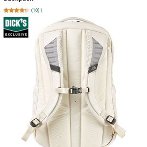 white and rose gold north face backpack